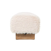 Detail van de zachte beige stof en de houten poot van het PTMD bankje