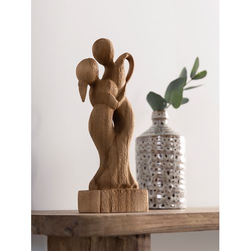 Beeld Dansend van MUST Living in een gestylede setting op een houten plank