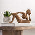 Beeld Relax Teakhout Naturel van MUST Living, ontspannen figuur in massief teak, volledig in beeld