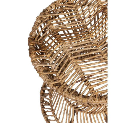 Bijzettafel Cala Vadella Ø36cm van abaca naast een fauteuil
