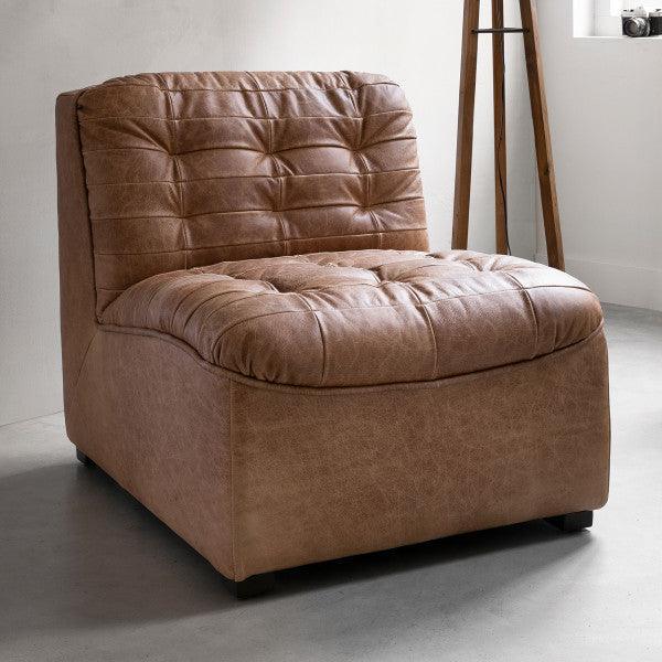 Fauteuil Liberty van MUST Living, schuin zijaanzicht van de leren kuip