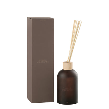 Geurstokjes Accords Essentiels Vanille Gourmande 550ml van J-Line, bruine glazen fles met geurstokjes naast de geschenkdoos