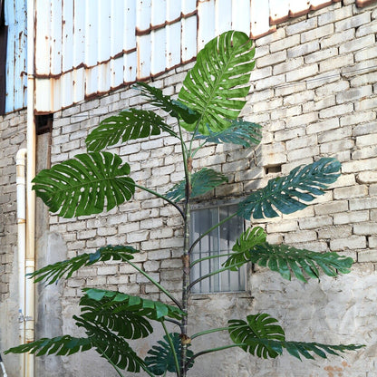 Grote kunstmonstera van PTMD van 420 cm in een ruimte met hoog plafond