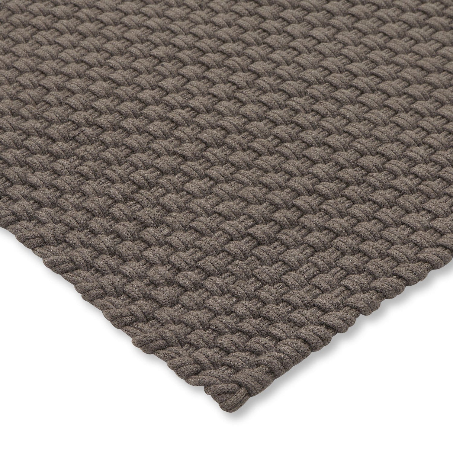 Detail van de geweven structuur van het Nomad tapijt in Grey Taupe