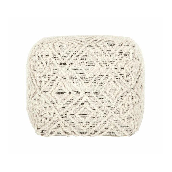 Detail van de handgeknoopte wol van de poef Quartz van MUST Living in antraciet en ivoor