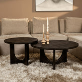Salontafel Guus Mangohout Zwart 80cm van Starfurn van opzij met zicht op het onderstel