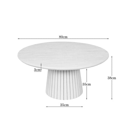 Bruine ronde salontafel Solana 80 cm bij een loungebank in een moderne woonkamer