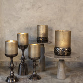 Set Van 3 Eliviana Windlichten Messing van PTMD, de windlichten in een sfeervolle interieursetting