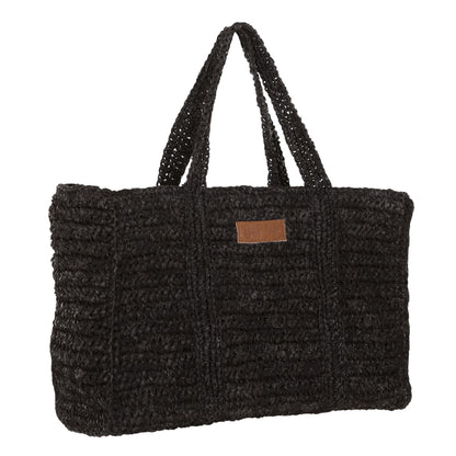Shopper Saint-Tropez van MUST Living in zwart palmblad gestyled in een natuurlijk interieur
