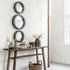 Spiegel Reflections Rond Small van MUST Living, ronde spiegel van 35 cm met smalle rand tegen een lichte wand