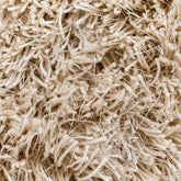 Vloerkleed Crown Beige 170x240cm van MUST Living schuin van opzij gezien, met zicht op de zijkant en de afwerking