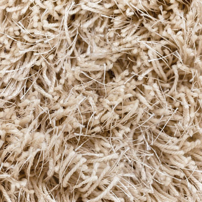 Vloerkleed Crown Beige Rond 150cm van MUST Living schuin van opzij gezien, met zicht op de zijkant en de afwerking