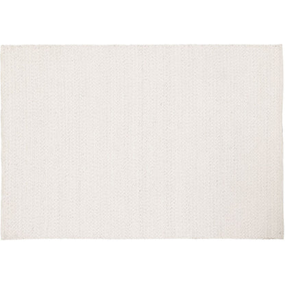 Vloerkleed Nirvana Ivoor 170x240cm van MUST Living schuin van opzij gezien, met zicht op de zijkant en de afwerking