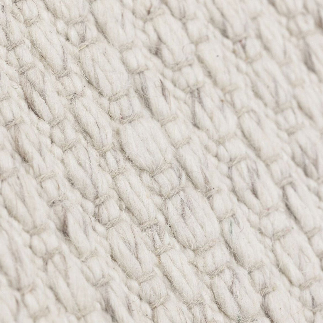 Detailfoto van Vloerkleed Nirvana Ivoor 170x240cm van MUST Living met zichtbare structuur van het materiaal