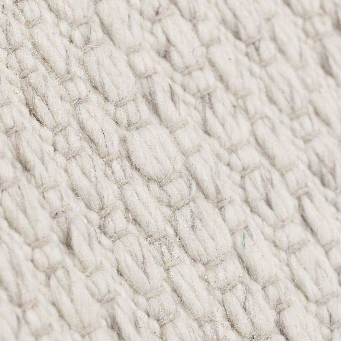 Detailfoto van Vloerkleed Nirvana Ivoor 170x240cm van MUST Living met zichtbare structuur van het materiaal