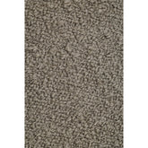 Detail van het taupe Noble vloerkleed van MUST Living met gemeleerde structuur